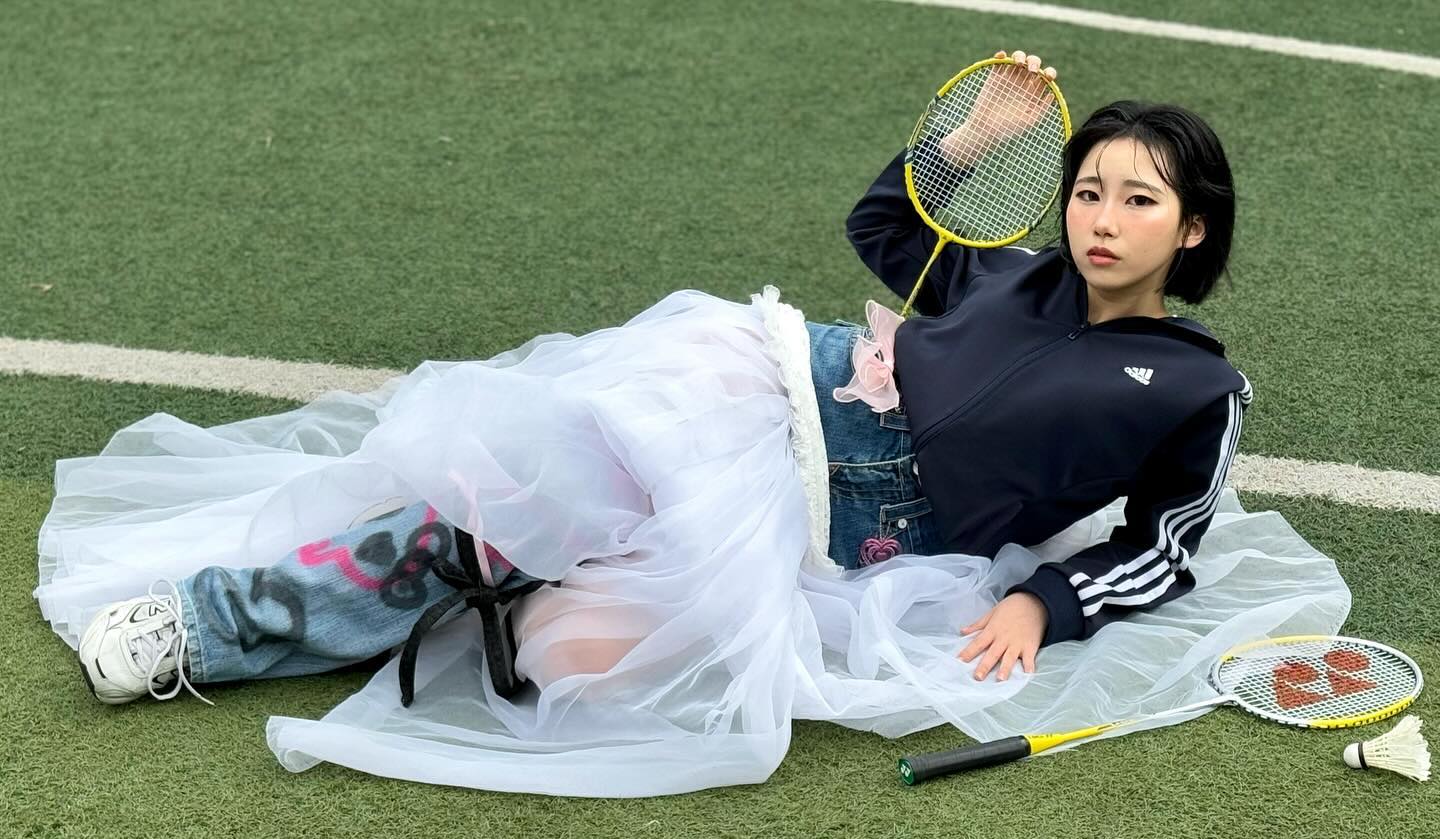 🏸